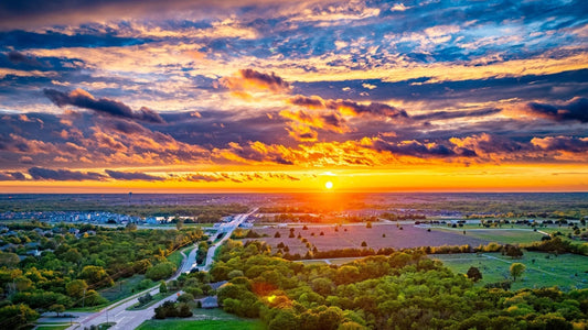 A drone photo of a Texas sunset above farmland. Image courtesy of photographer Charles Davis.