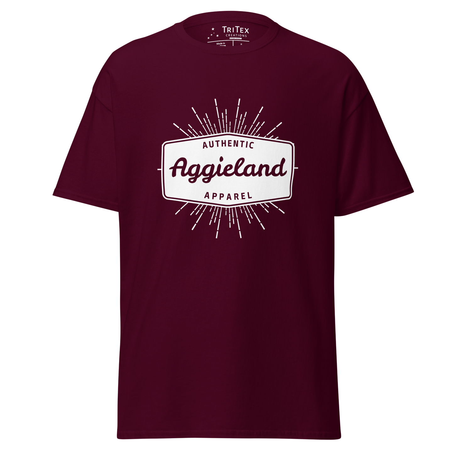 A maroon t-shirt with a badge that says "Authentic Aggieland apparel".