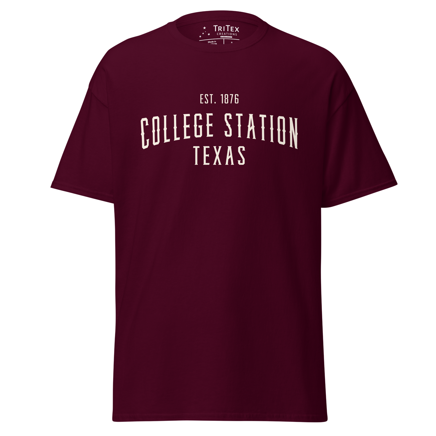 A maroon t-shirt with the words "College Station Texas Est. 1876".