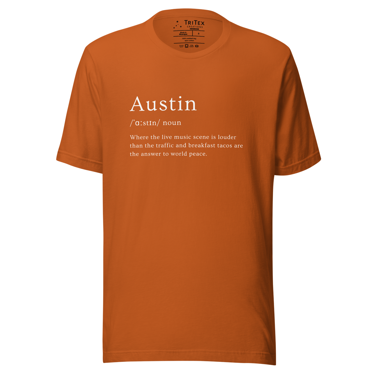 An autumn-colored t-shirt with the words "Austin where the live music scene is louder than the traffic and breakfast tacos are the answer to world peace".