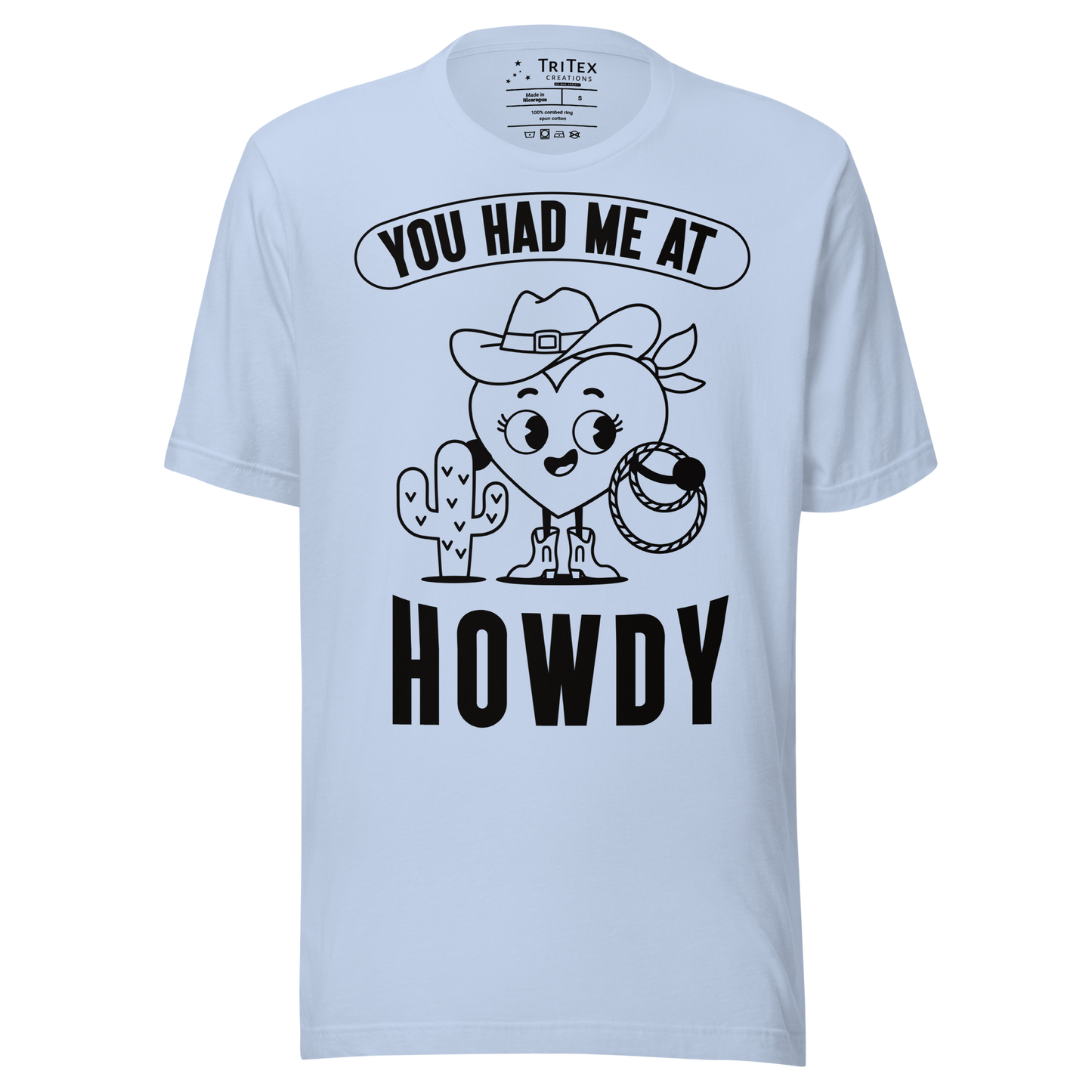 A baby blue t-shirt featuring a cartoon heart dressed like a cowboy with the words "You has me at howdy".