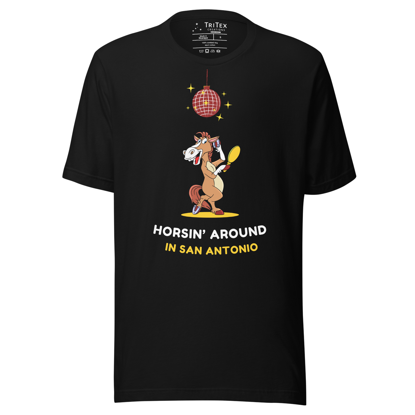 A black t-shirt featuring an image of a cartoon horse primping under a sparkling disco ball with the words "Horsin' around in San Antonio".