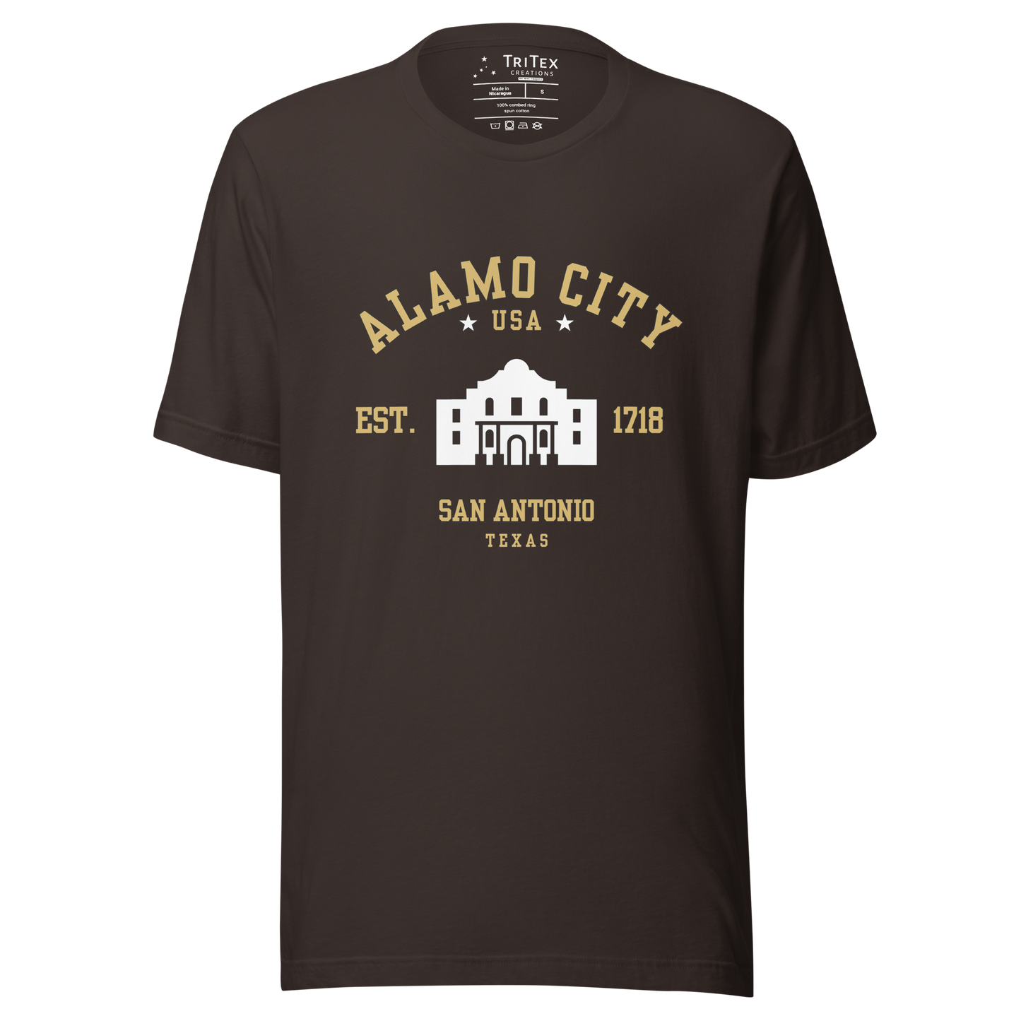 A brown t-shirt featuring an image of The Alamo with the words "Alamo City USA Est. 1718 San Antonio Texas".
