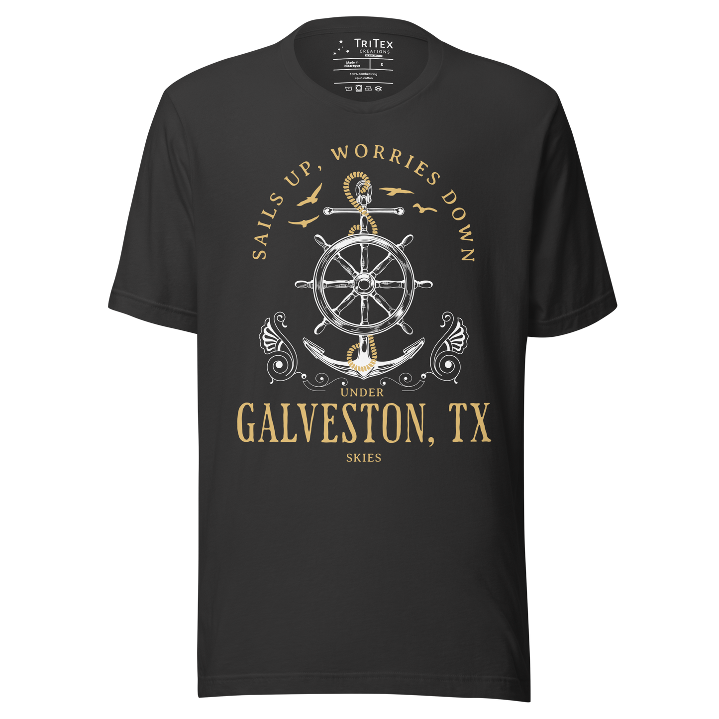 A dark gray t-shirt featuring an anchor and seagulls with the words "Sails up, worries down under Galveston, TX skies".