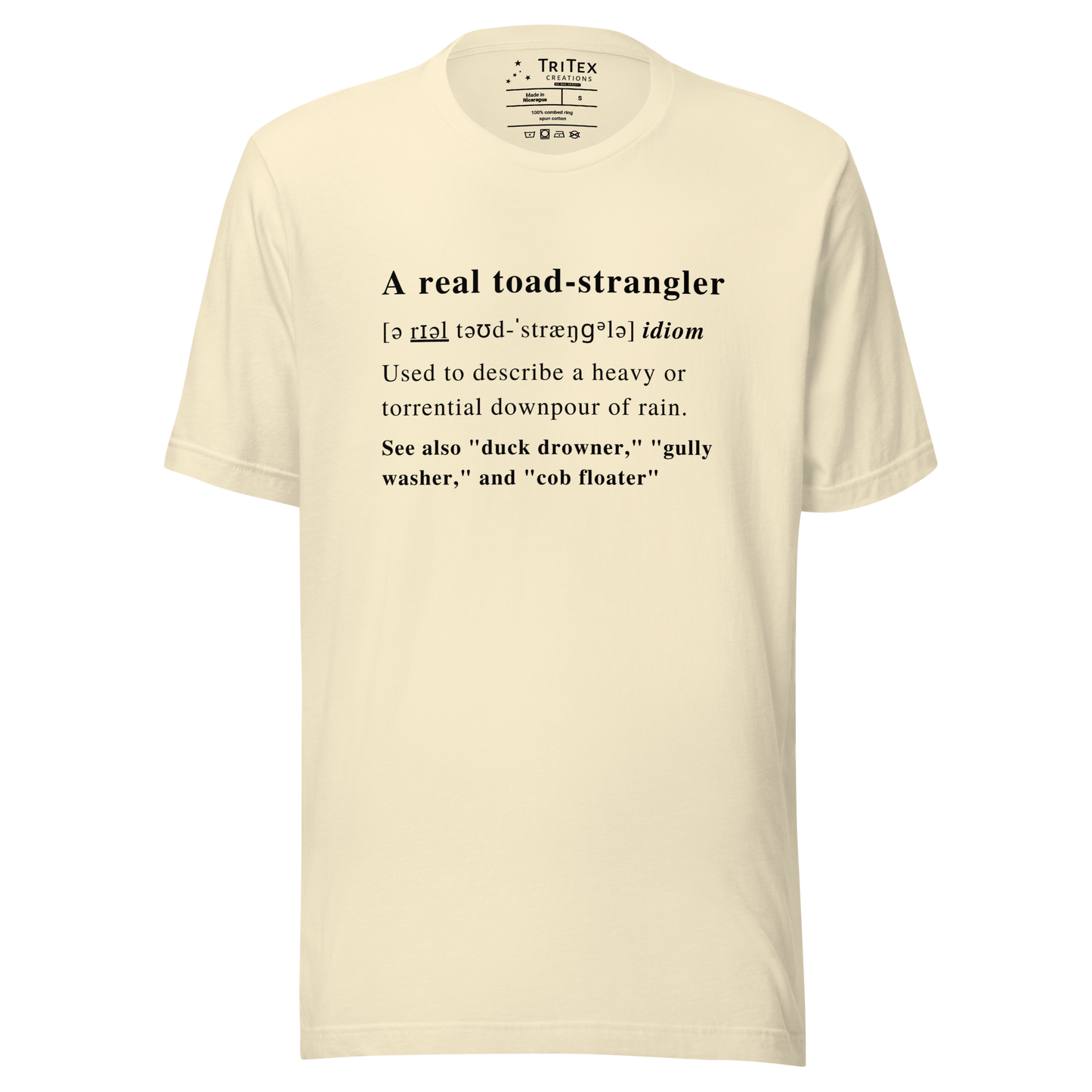 A natural-colored t-shirt that describes the meaning of "A real toad-strangler" in the style of a dictionary entry.