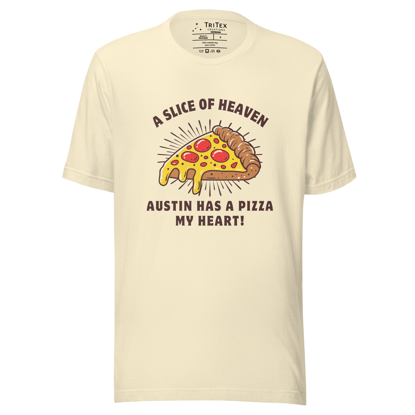 A natural-colored t-shirt featuring an image of a slice of pizza with the words" A slice of heaven Austin has a pizza my heart!".
