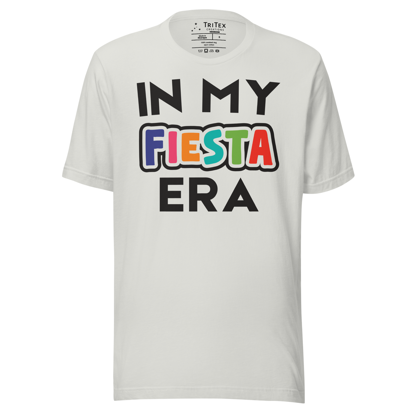 A silver t-shirt that reads "In My Fiesta Era" with Fiesta in Southwestern colors.