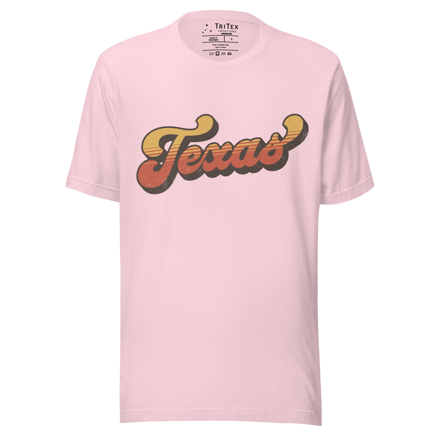 A soft pink t-shirt with a retro style Texas in a vintage font.
