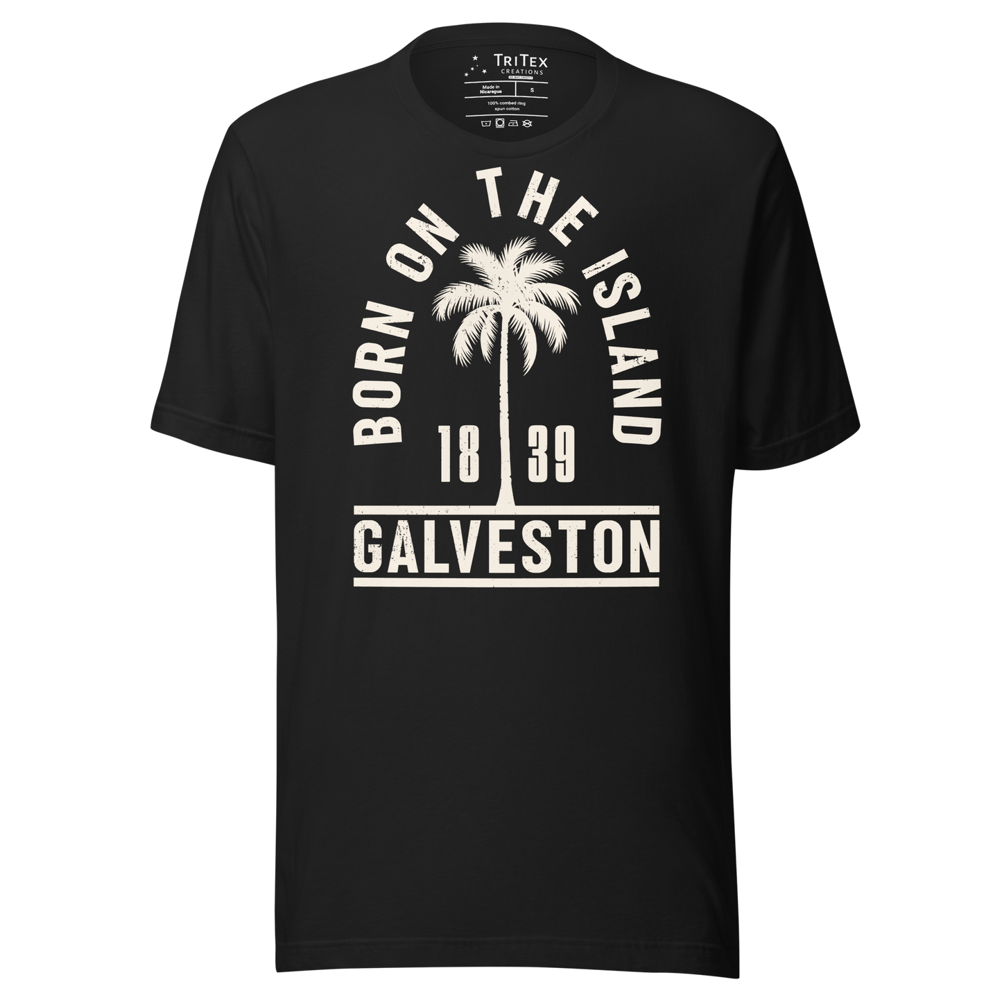 A vintage black t-shirt featuring a palm tree with the words "Born on the island. Galveston 1839" with a silhouette of a palm tree.