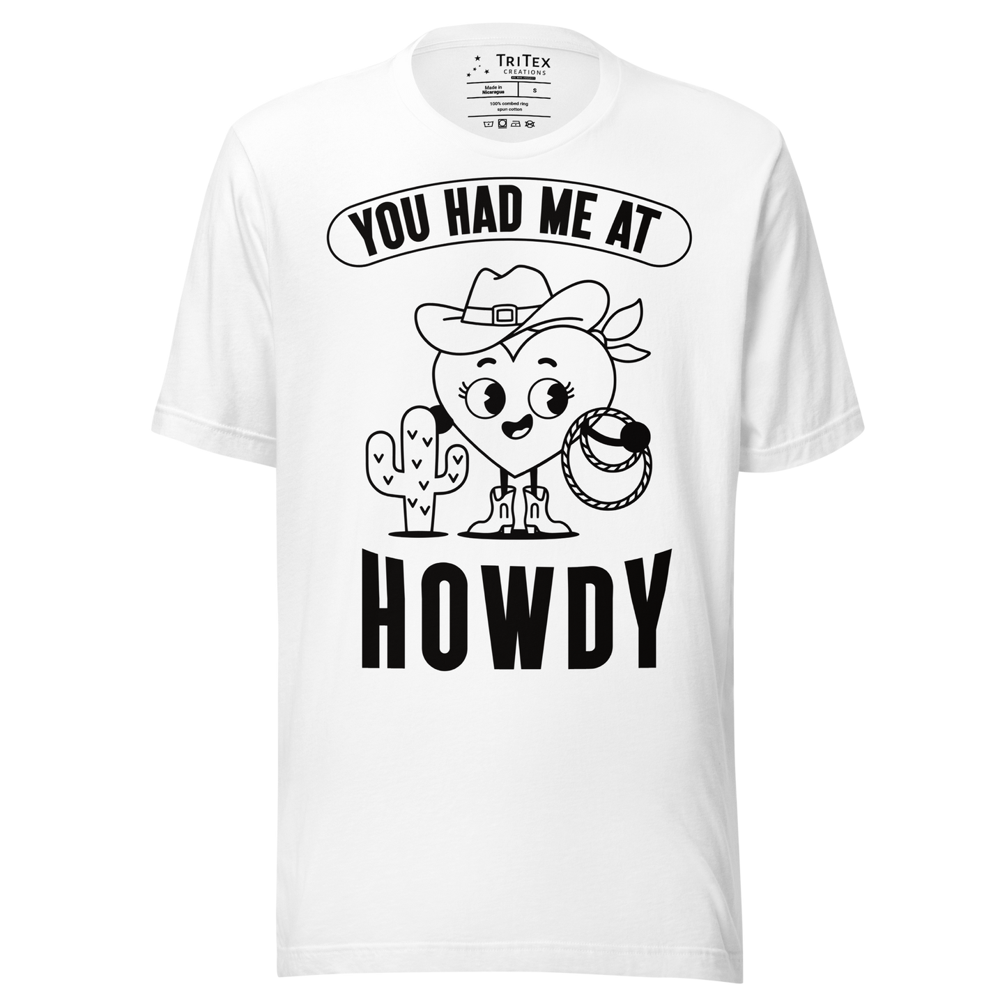 A white t-shirt featuring a cartoon heart dressed like a cowboy with the words "You has me at howdy".