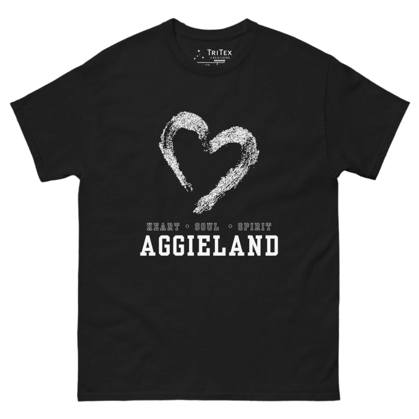 A black t-shirt featuring the outline of a hear with the words "Heart • Soul • Spirit Aggieland"