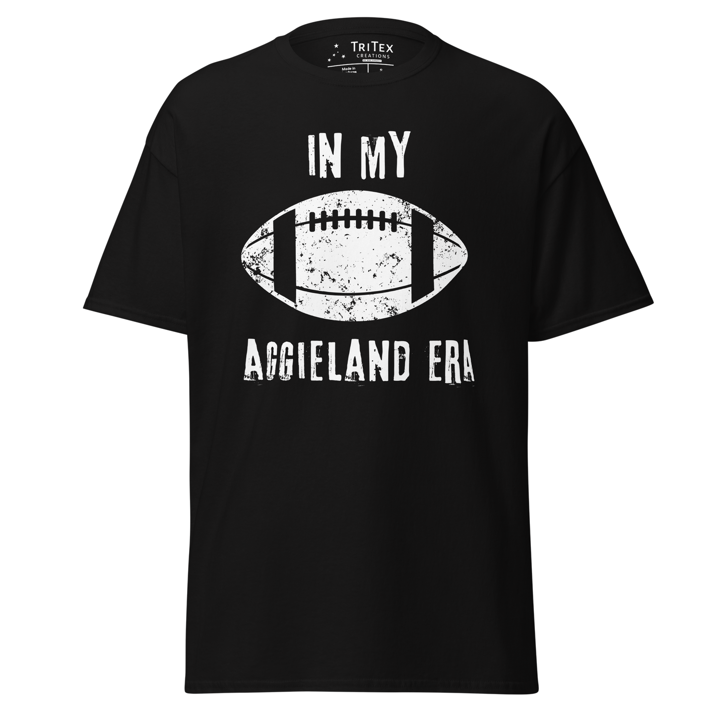 A black t-shirt featuring a silhouette of a football with the words "In my Aggieland era".