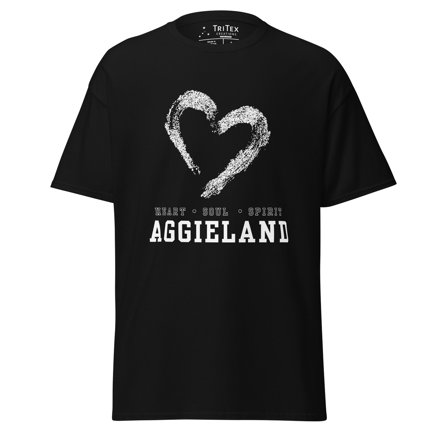 A black t-shirt featuring the outline of a heart with the words "Heart, soul, spirit Aggieland".