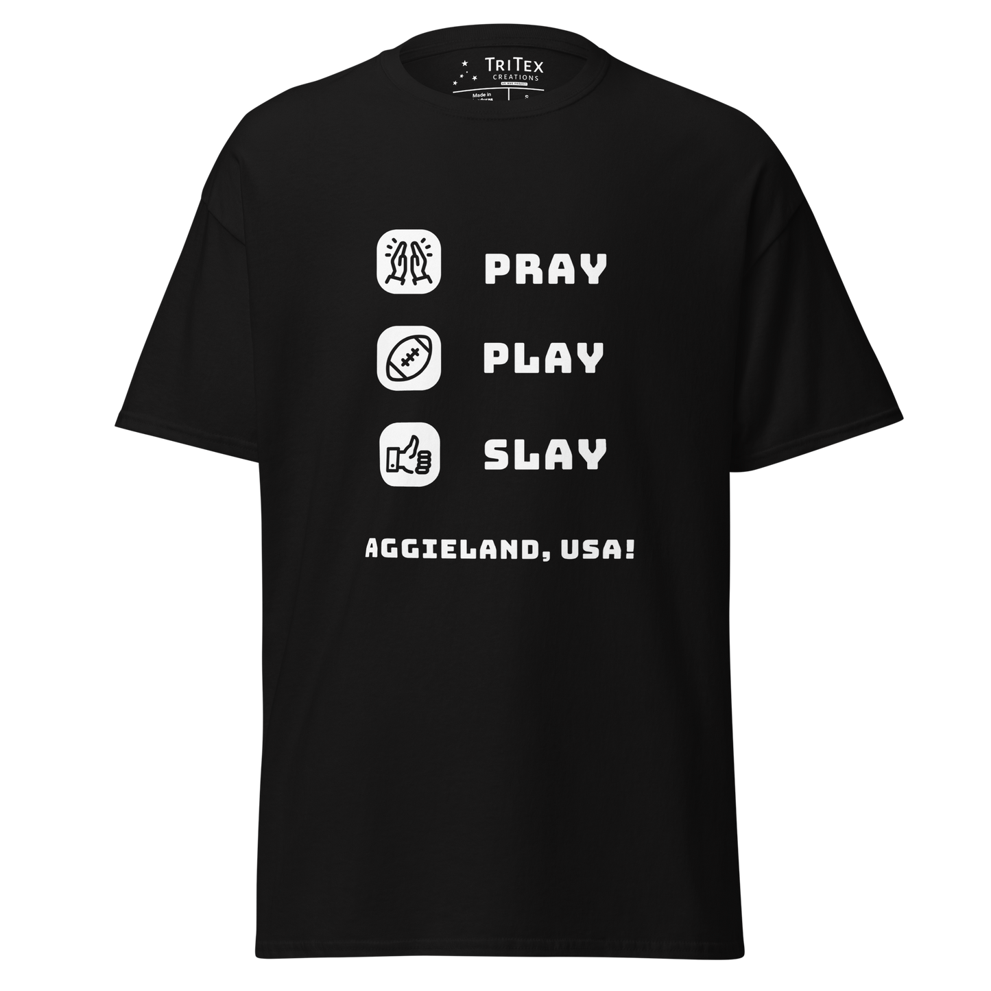A black t-shirt featuring the words "Pray, Play, Slay, Aggieland, USA!" with matching icons.