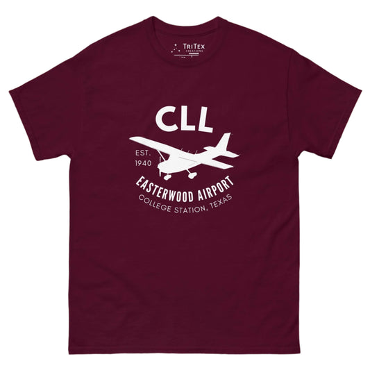 A maroon t-shirt featuring a silhouette of a Cessna airplane with the words "CLL Est. 1940 Easterwood Airport College Station, Texas".