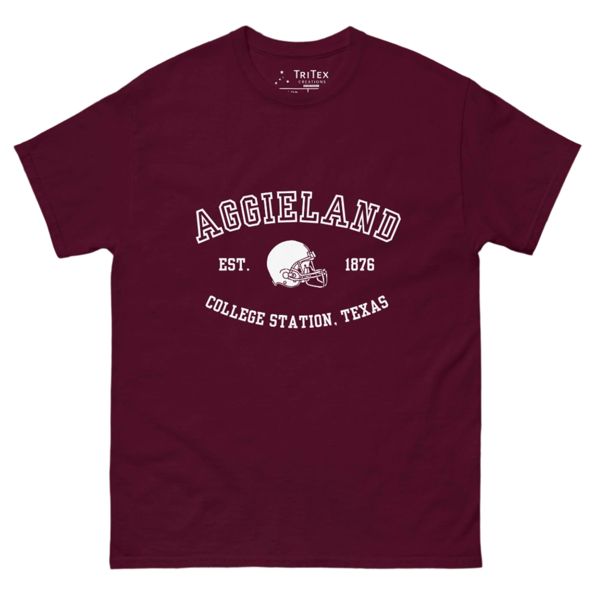 A maroon t-shirt featuring a graphic image of a football helmet with the words "Aggieland Est. 1876 College Station, Texas".