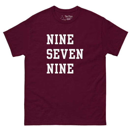 A maroon t-shirt with the words "NINE SEVEN NINE".