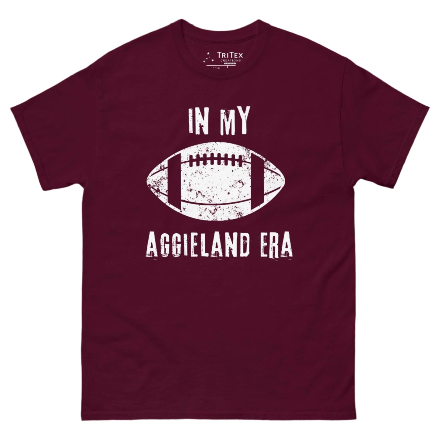 A maroon t-shirt featuring a vintage graphic of a football and the text "In My Aggieland Era".