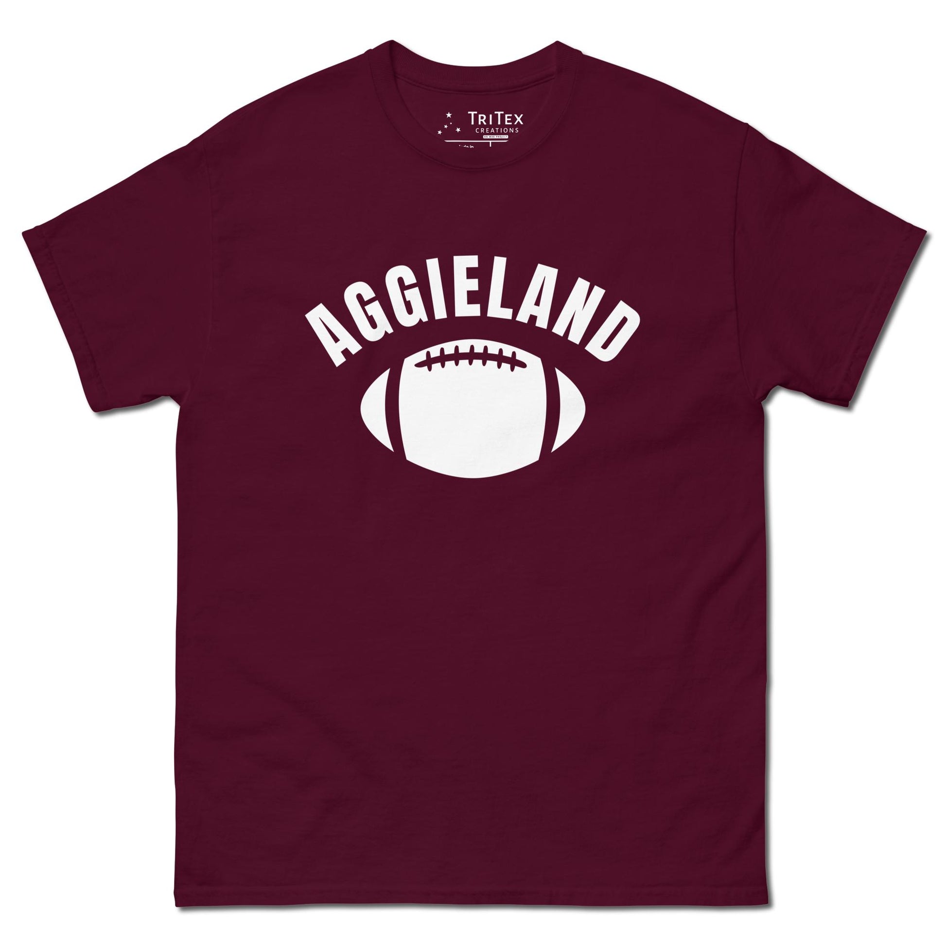 A maroon t-shirt featuring a football with the word "Aggieland".