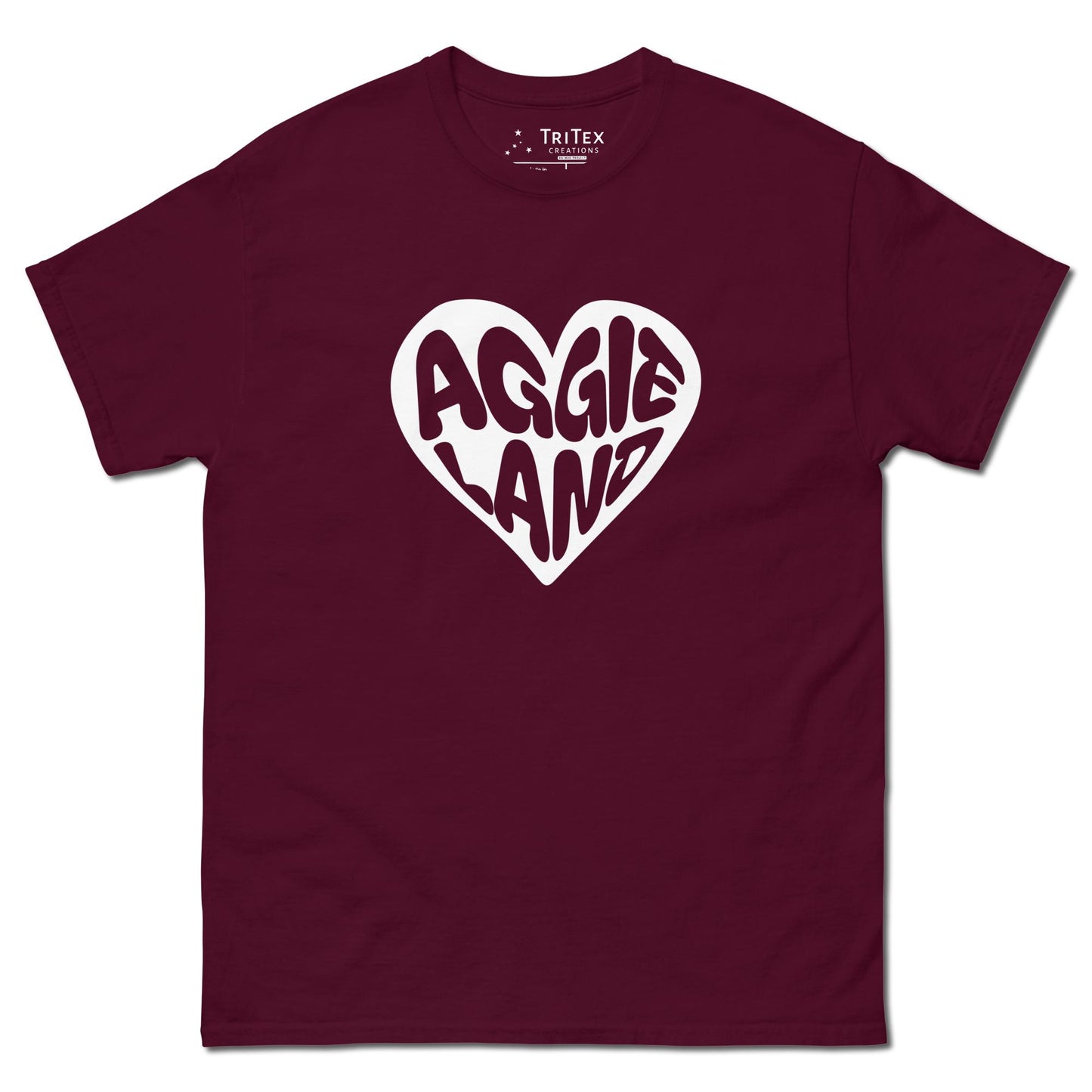 A maroon t-shirt featuring a white heart with "Aggieland" written in it.