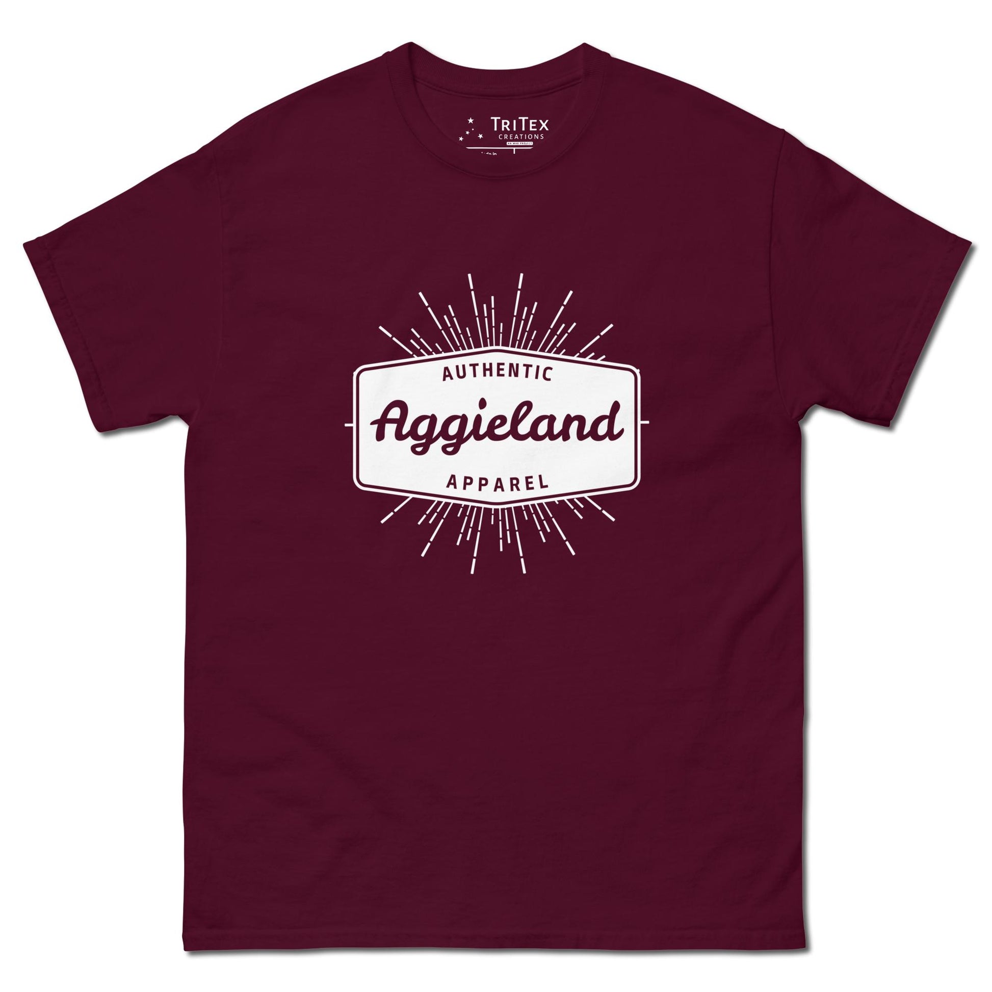 A maroon t-shirt with a badge that says "Authentic Aggieland apparel".