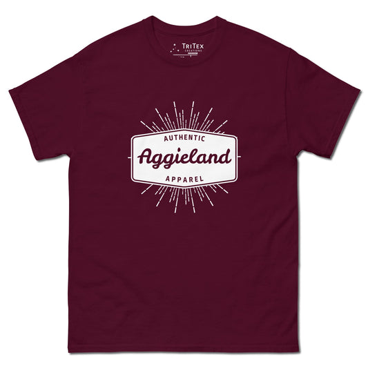 A maroon t-shirt with a badge that says "Authentic Aggieland apparel".