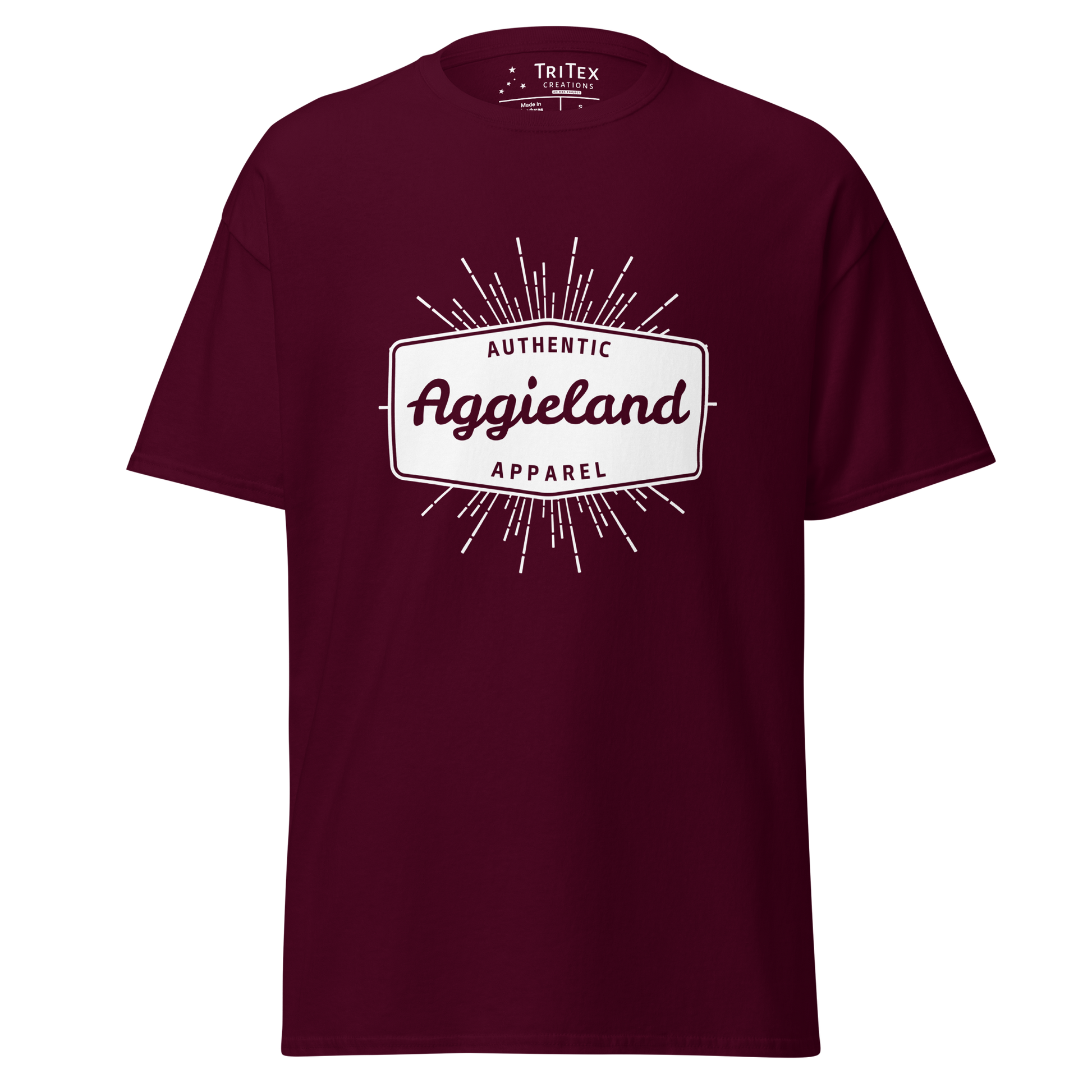 A maroon t-shirt with a badge that says "Authentic Aggieland apparel".
