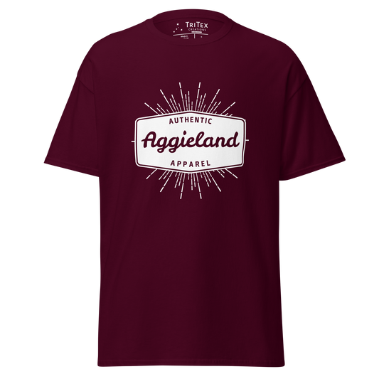 A maroon t-shirt with a badge that says "Authentic Aggieland apparel".
