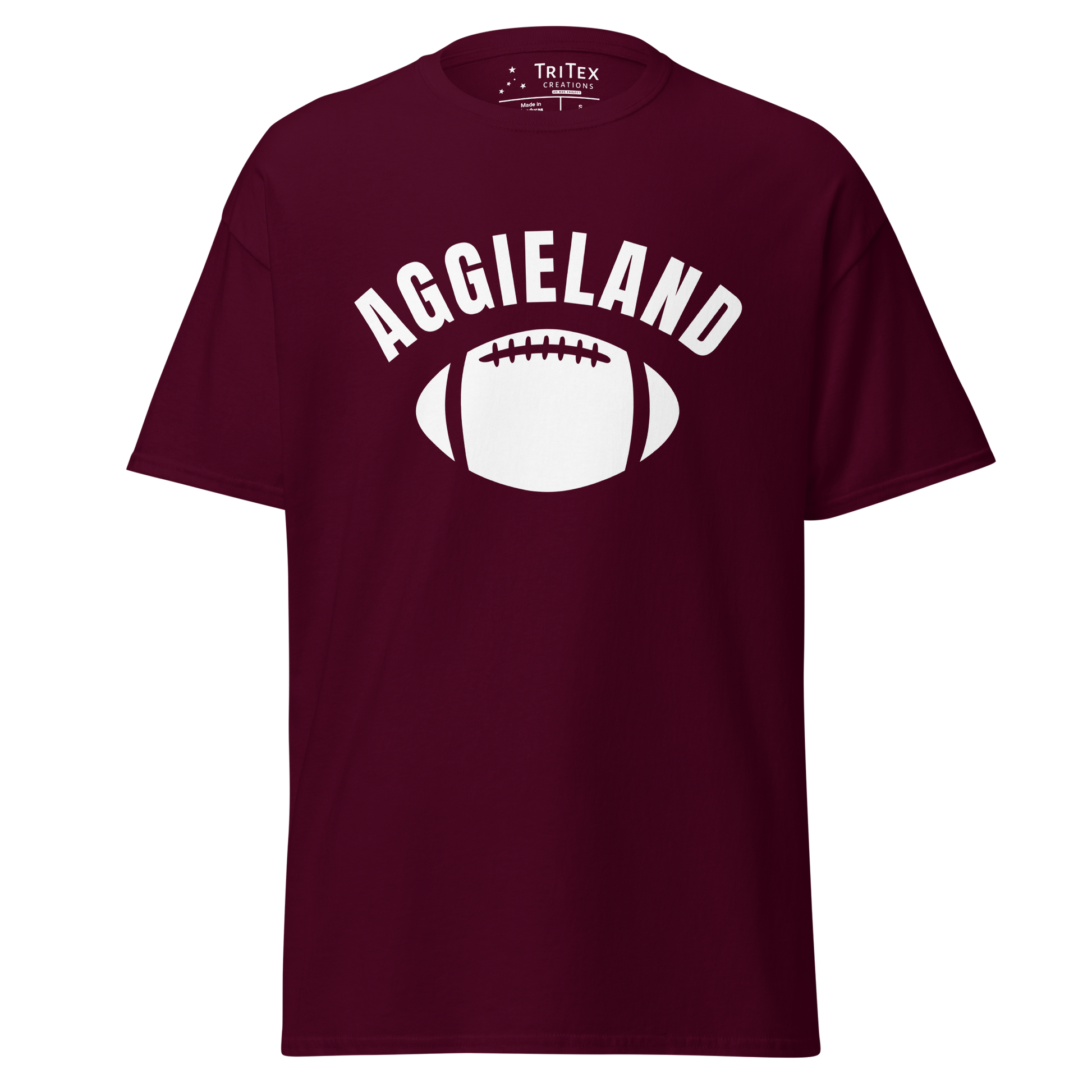 A maroon t-shirt featuring a football with the word "Aggieland".