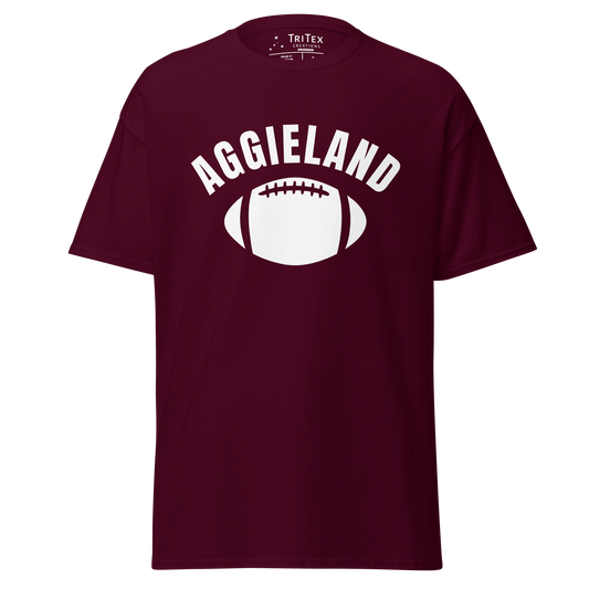 A maroon t-shirt featuring a football with the word "Aggieland".