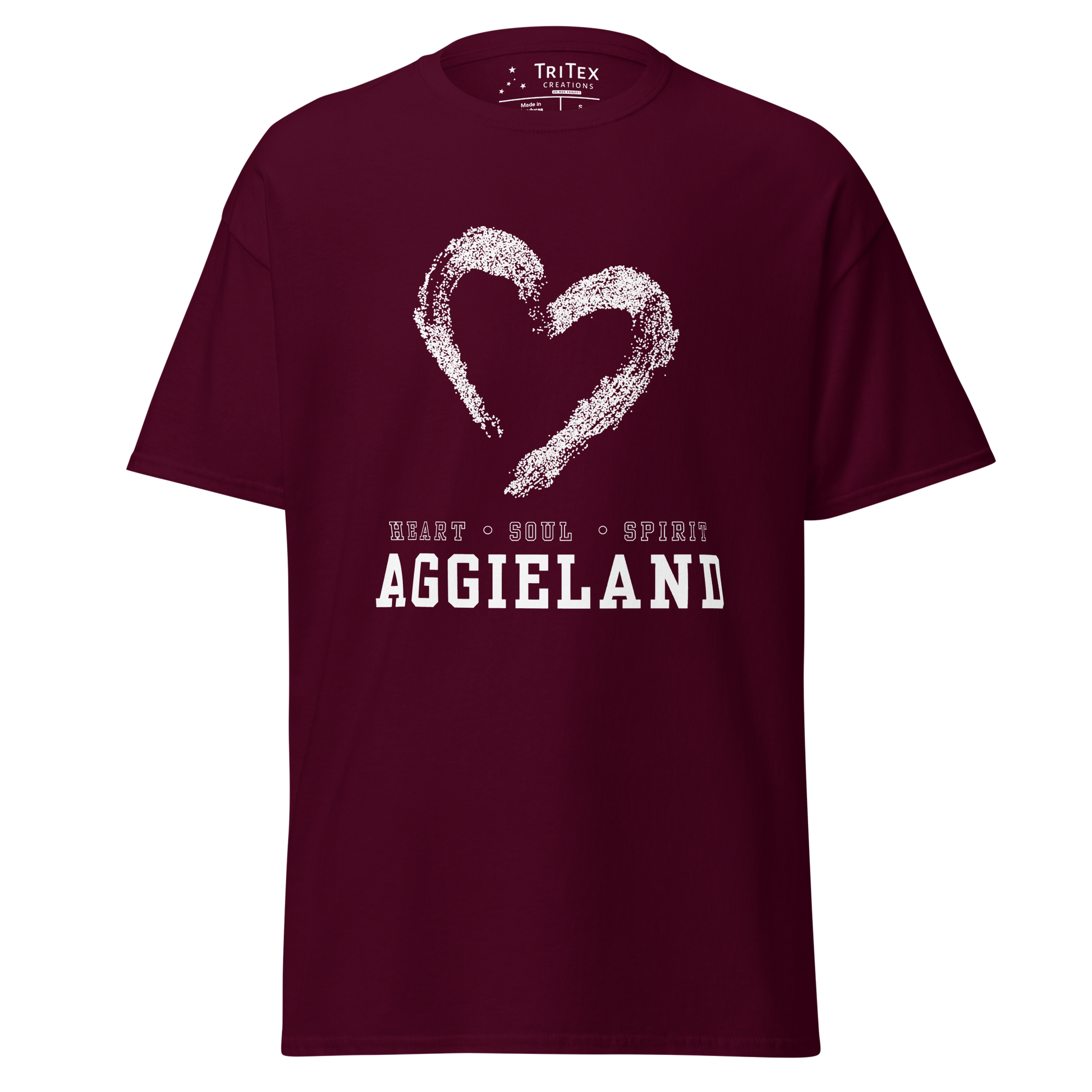A maroon t-shirt featuring the outline of a heart with the words "Heart, soul, spirit Aggieland".