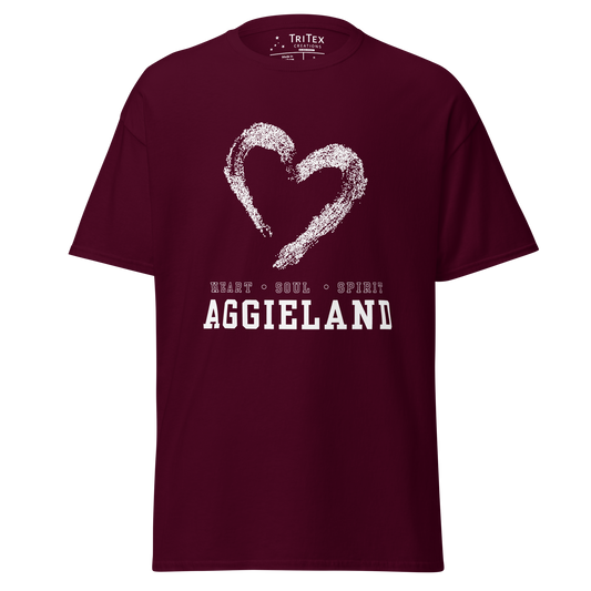 A maroon t-shirt featuring the outline of a heart with the words "Heart, soul, spirit Aggieland".