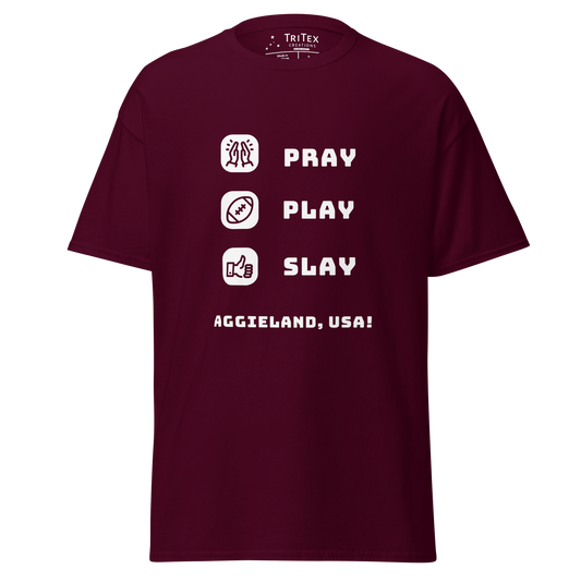 A maroon t-shirt featuring the words "Pray, Play, Slay, Aggieland, USA!" with matching icons.