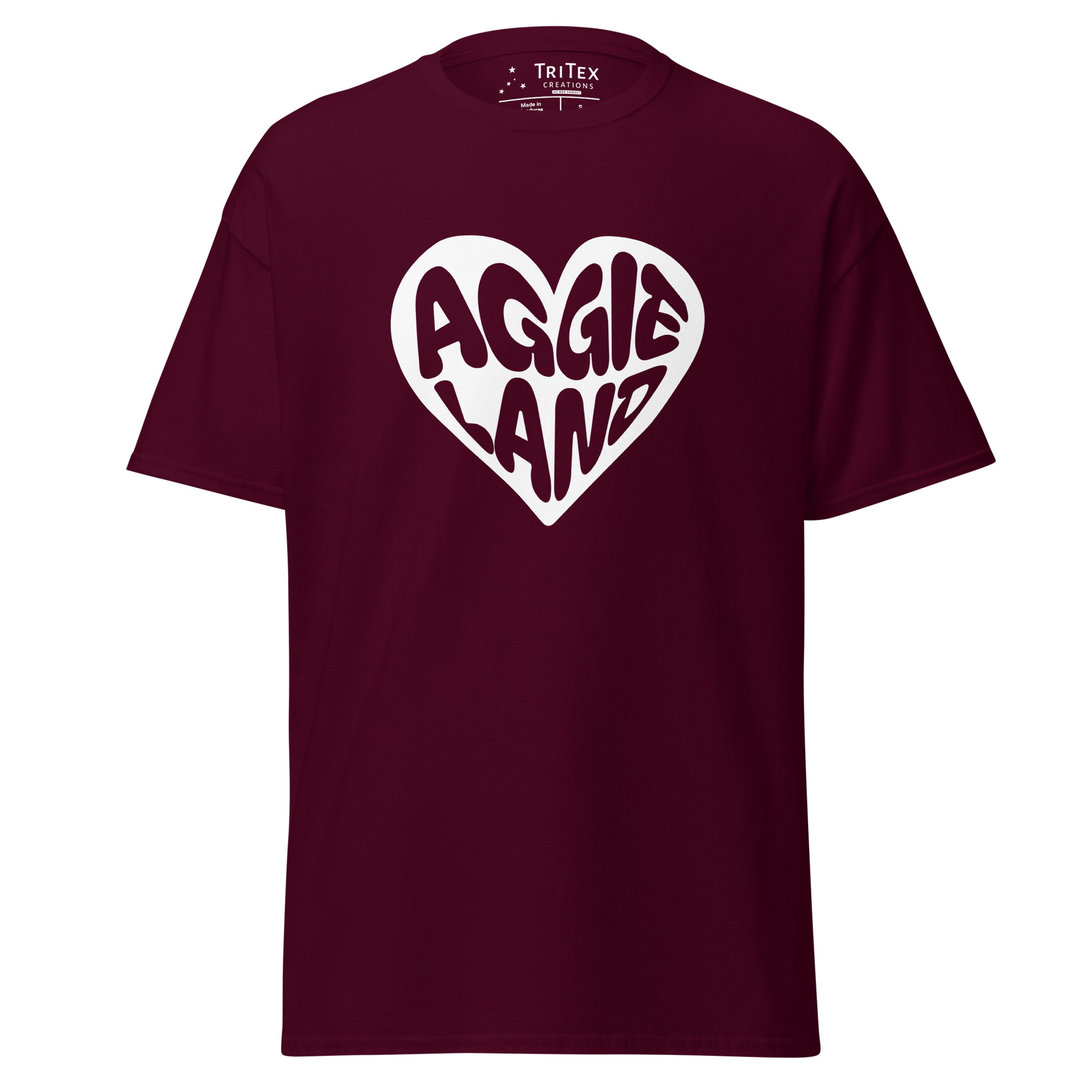 A maroon t-shirt featuring a white heart with "Aggieland" written in it.