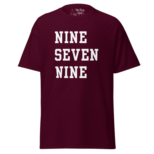 A maroon t-shirt with the words "NINE SEVEN NINE".