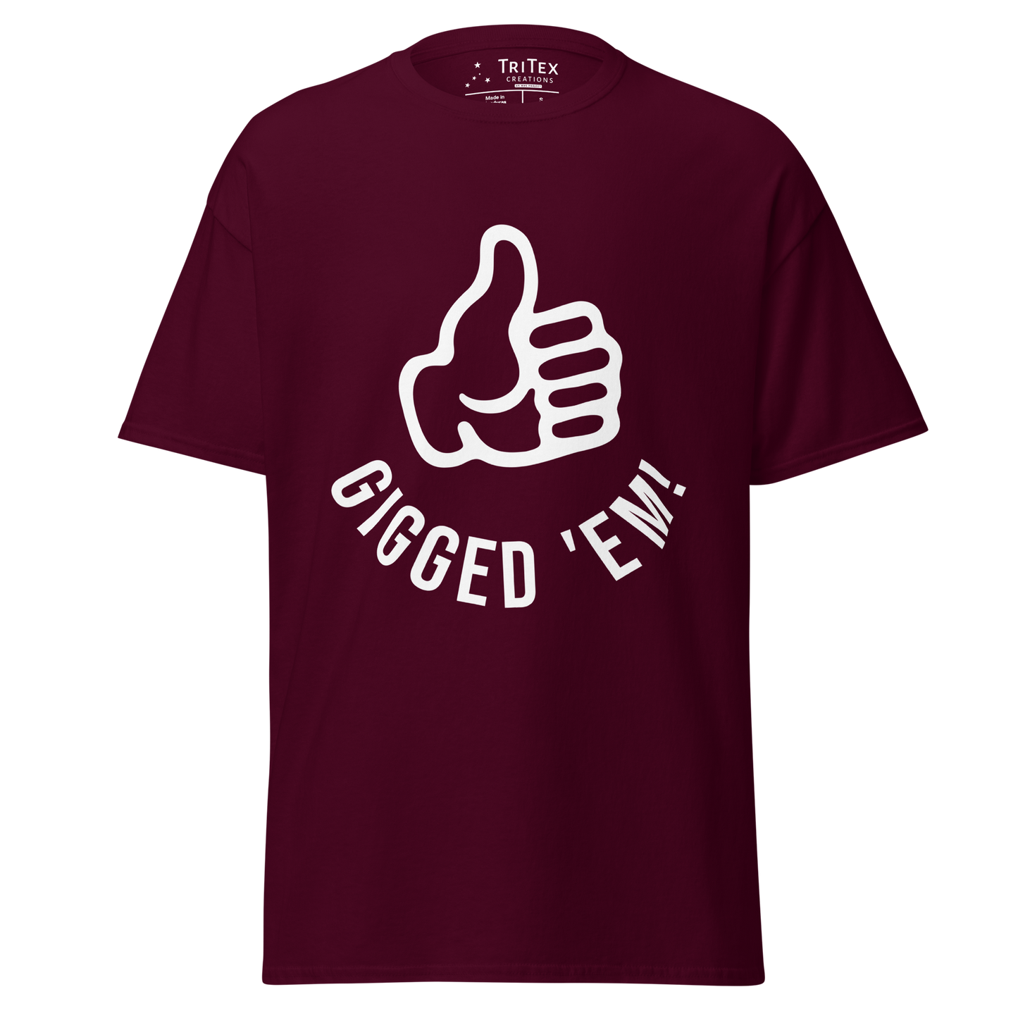 A maroon t-shirt featuring a left hand with it's thumb up and the text "Gigged 'em!".