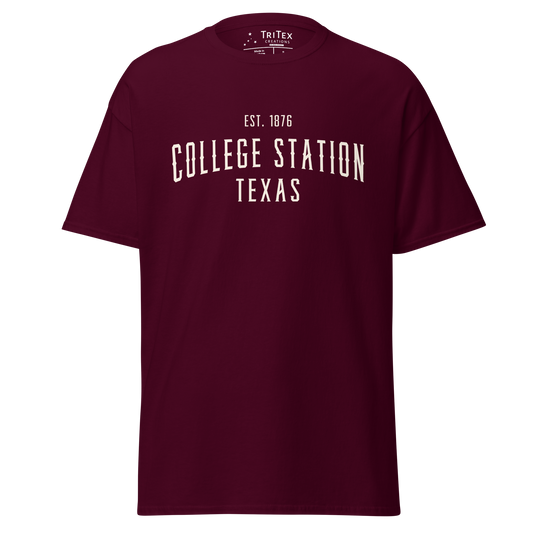 A maroon t-shirt with the words "College Station Texas Est. 1876".