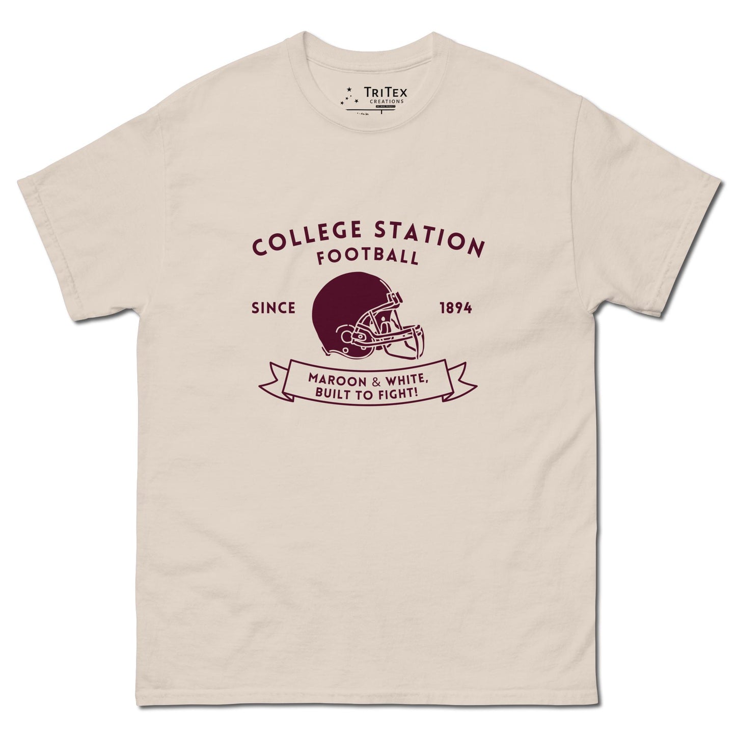 A natural-colored shirt with the text "College Station football since 1894 Maroon & White, Built to fight!" featuring an image of a football helmet.