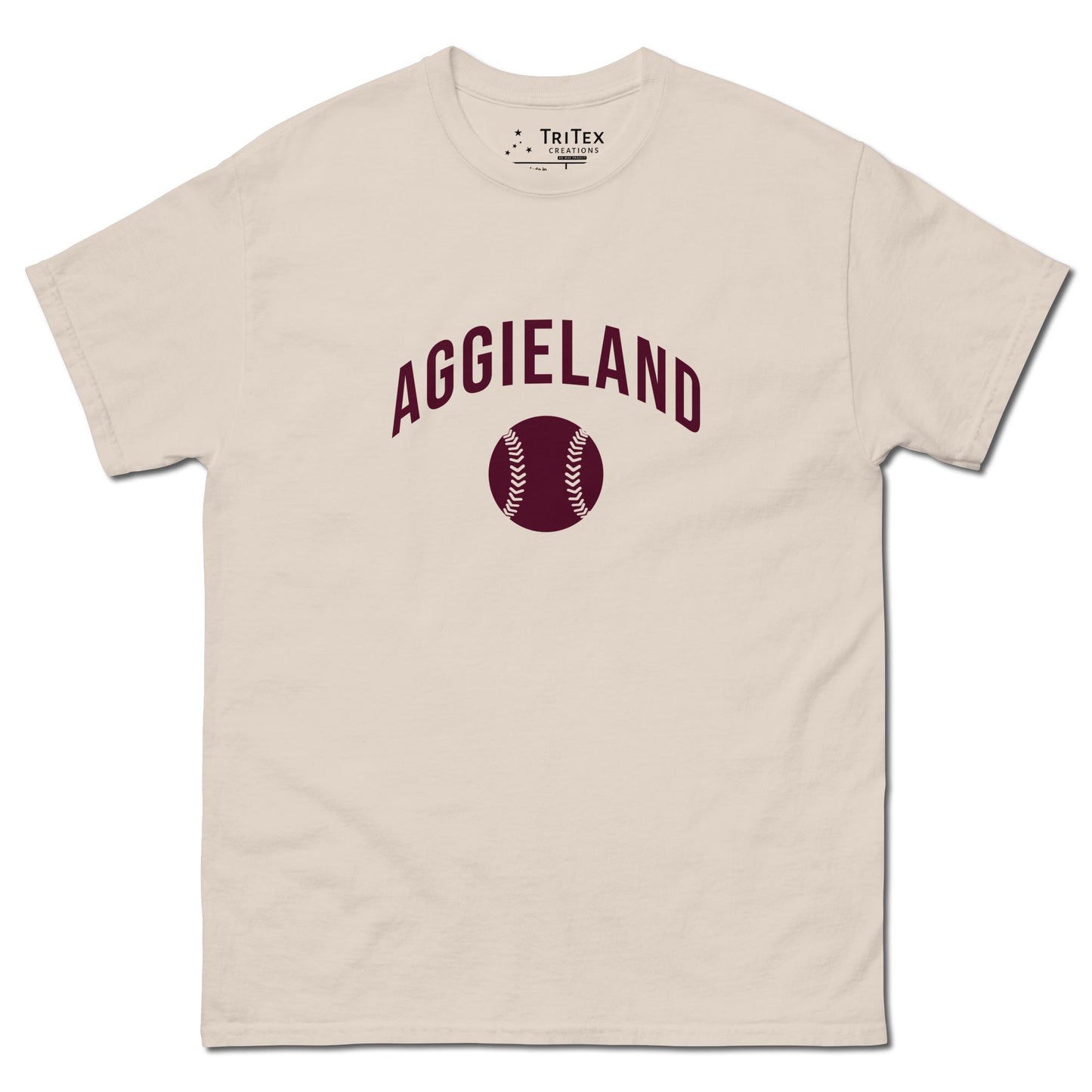 A natural-colored t-shirt featuring an image of a baseball with the words "Aggieland".