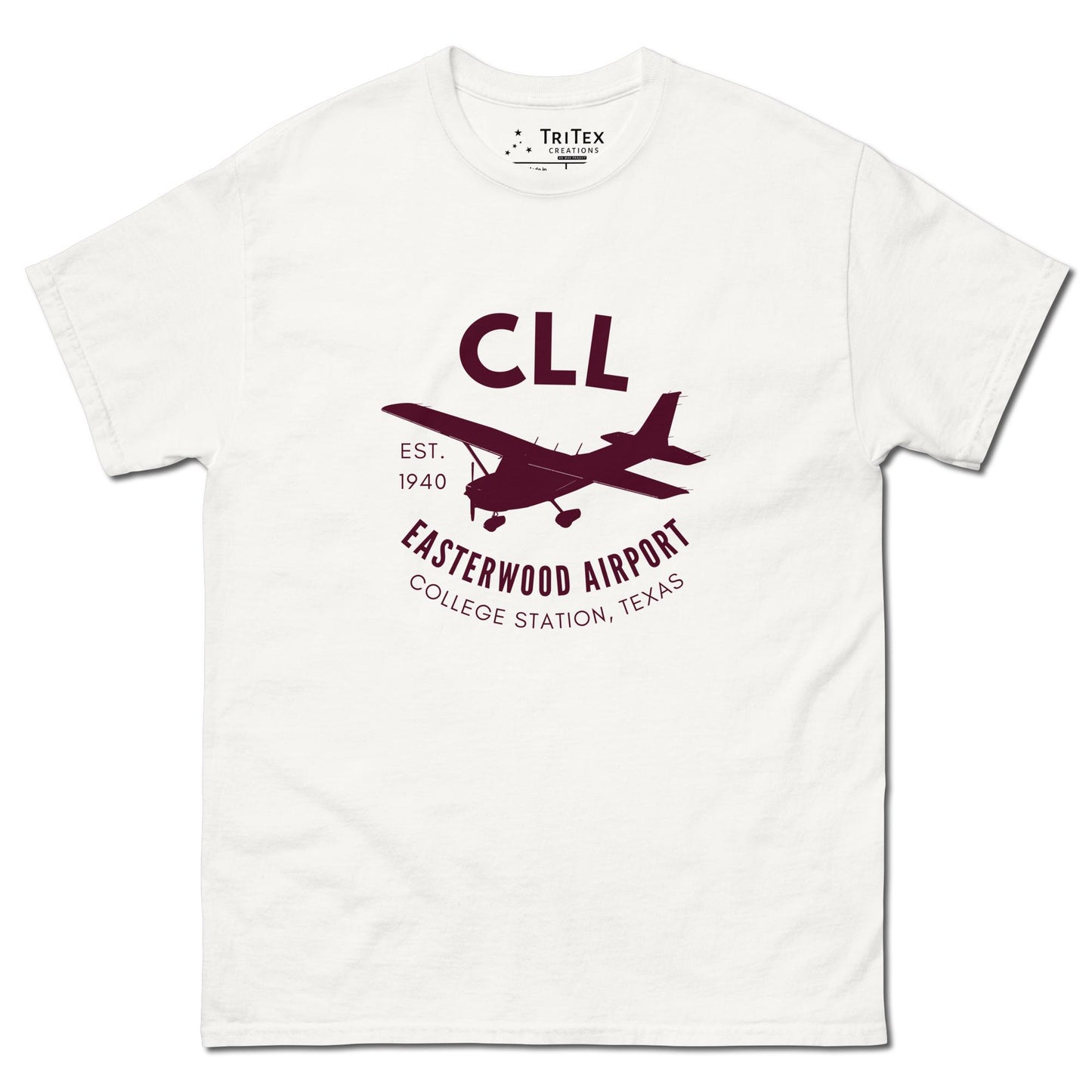 A white t-shirt featuring a silhouette of a Cessna airplane with the words "CLL Est. 1940 Easterwood Airport College Station, Texas".