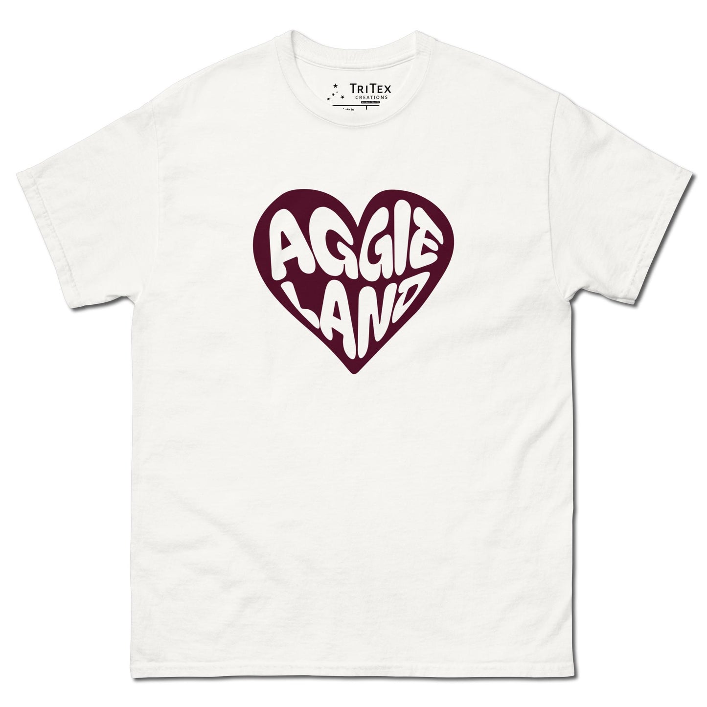 A white t-shirt featuring a maroon heart with "Aggieland" written in it.