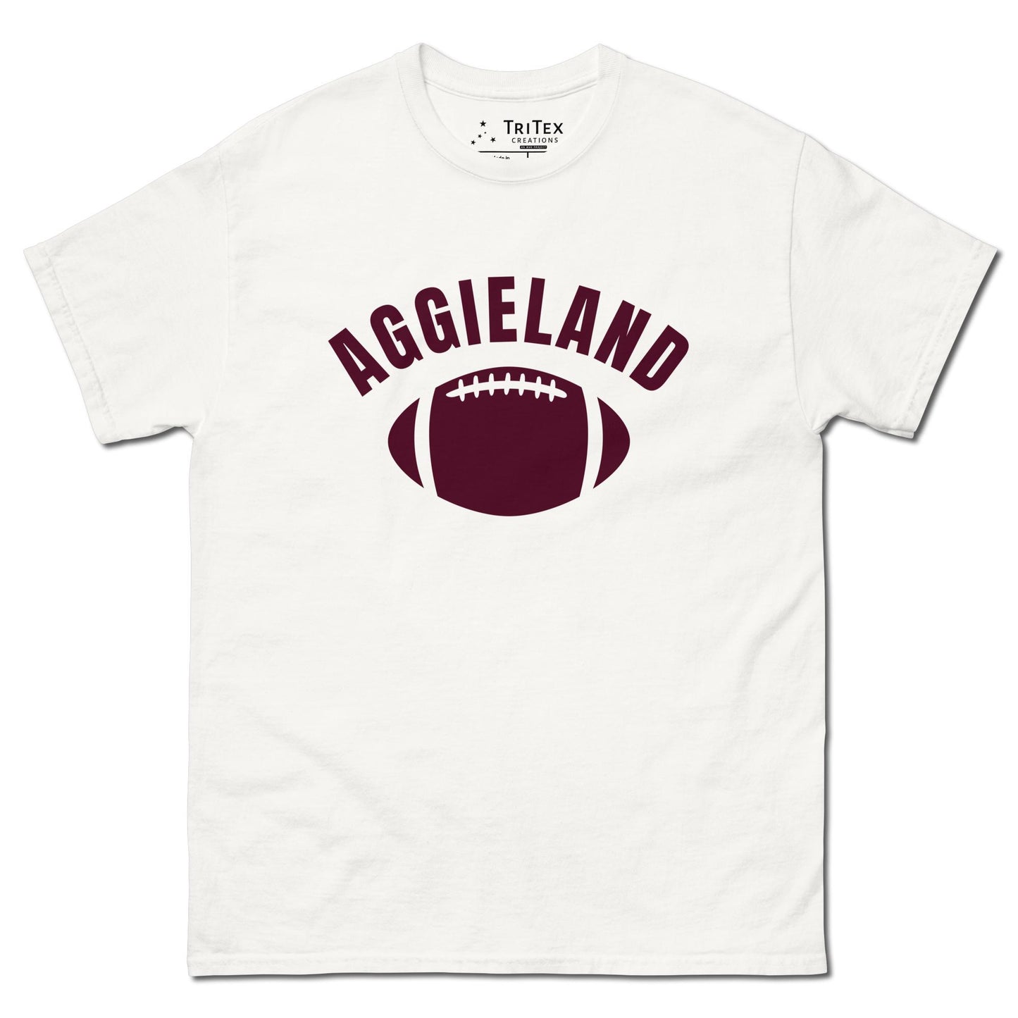 A white t-shirt featuring a football with the word "Aggieland".