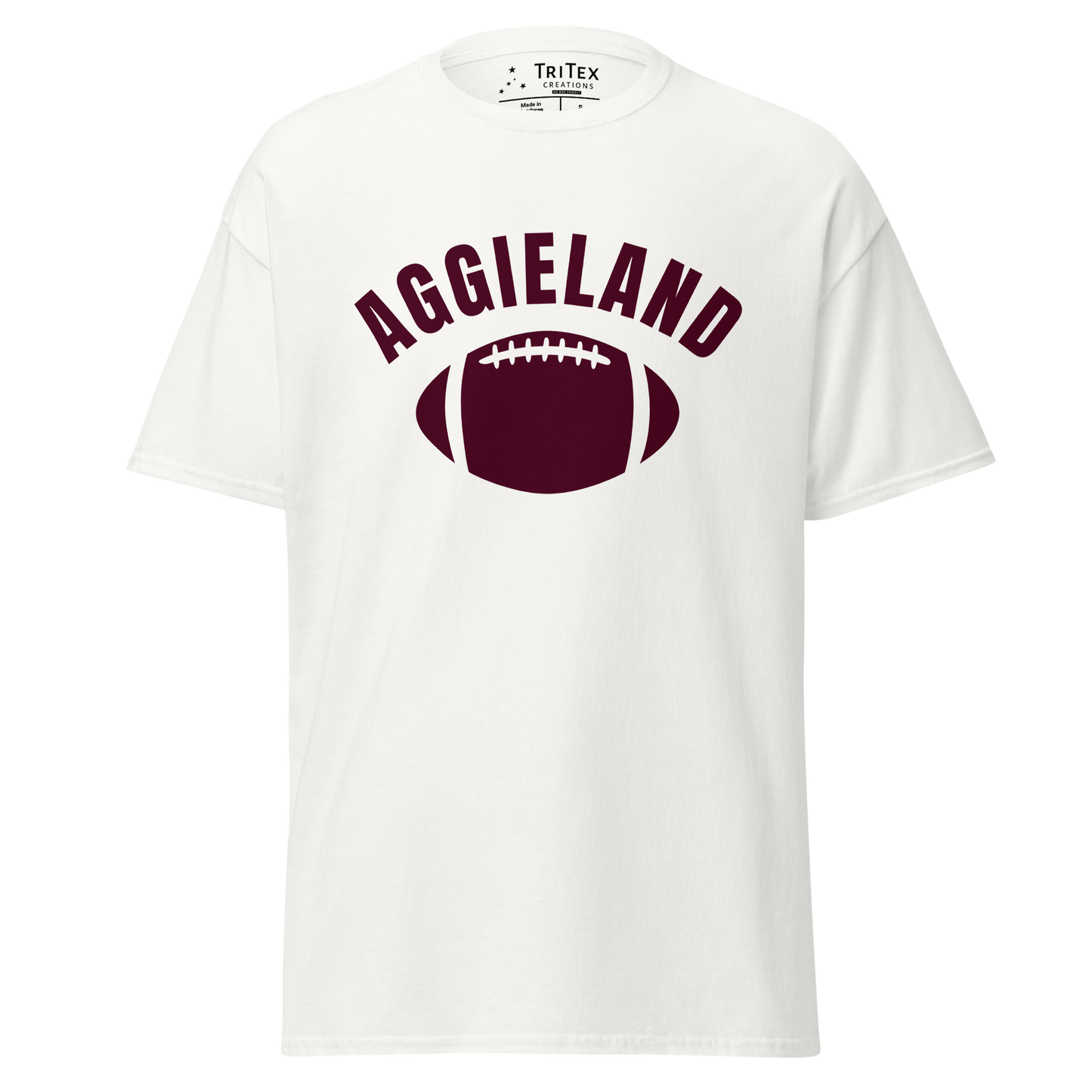 A white t-shirt featuring a football with the word "Aggieland".