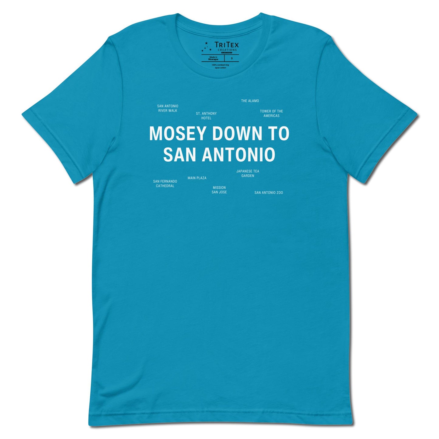 An aqua blue t-shirt which reads "Mosey Down To San Antonio" in big, bold text with smaller text elements naming San Antonio's landmarks.