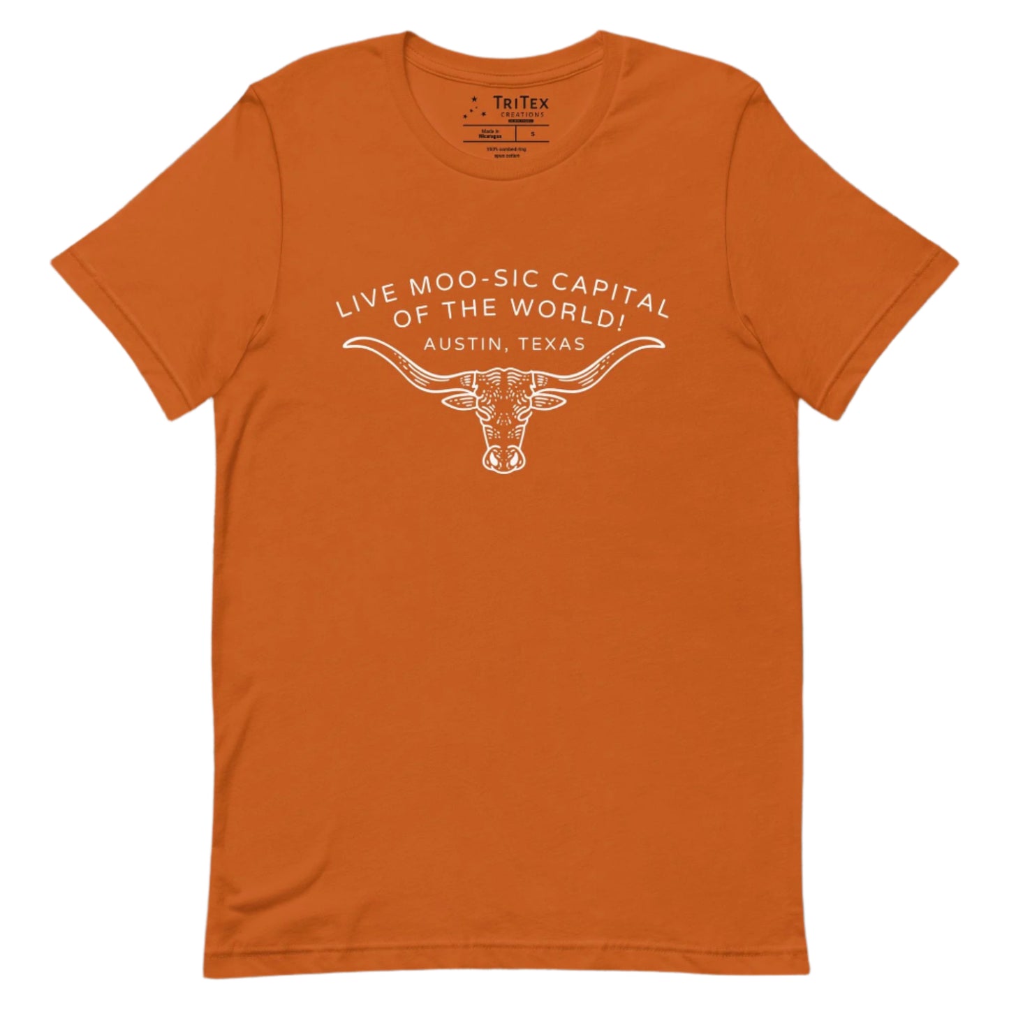 An autumn-colored t-shirt featuring an image of a longhorn bull with the words "Live moo-sic capital of the world! Austin, Texas".