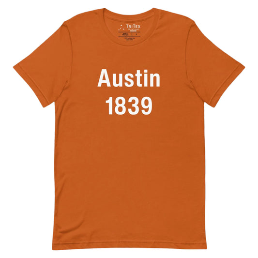 An autumn-colored t-shirt with the words "Austin 1839".