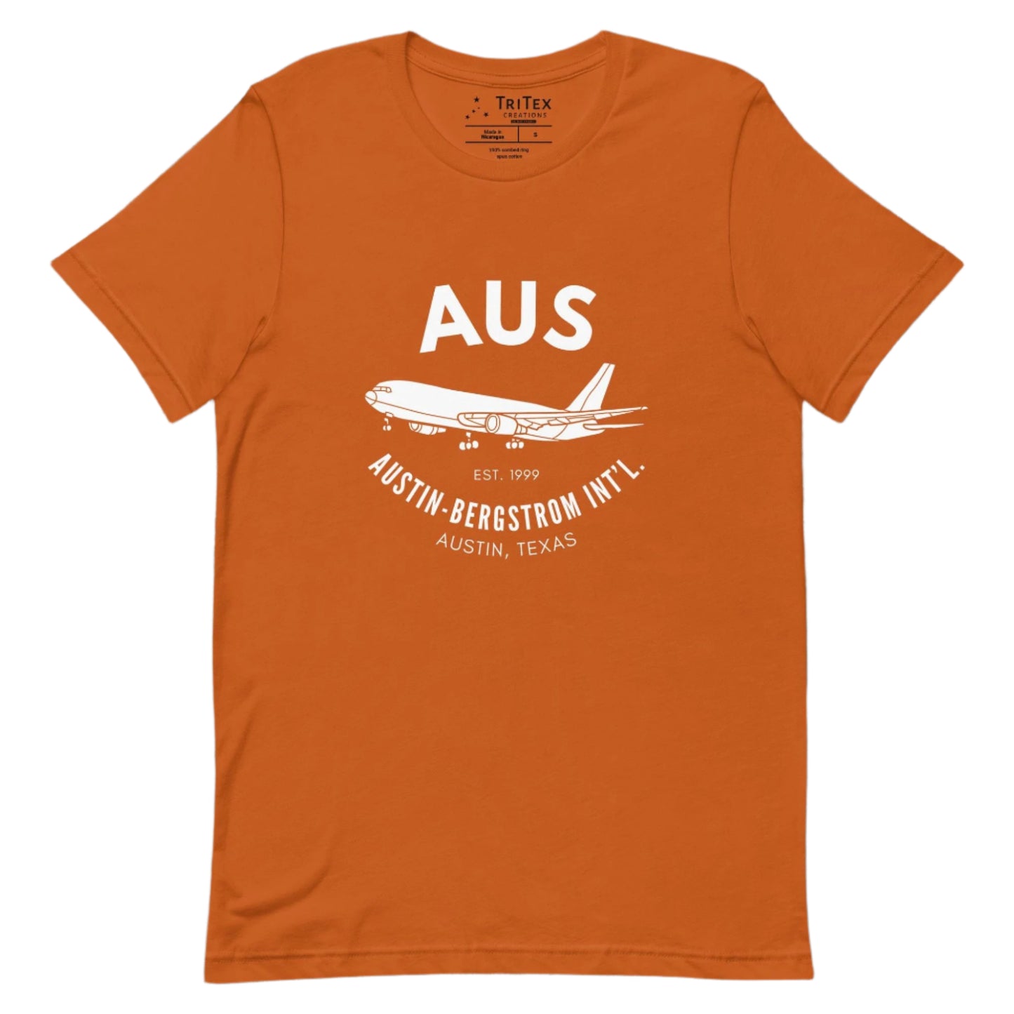 An autumn-colored shirt featuring an image of an airplane with the words "AUS Est. 1999 Austin-Bergstrom Int'l. Austin, Texas".