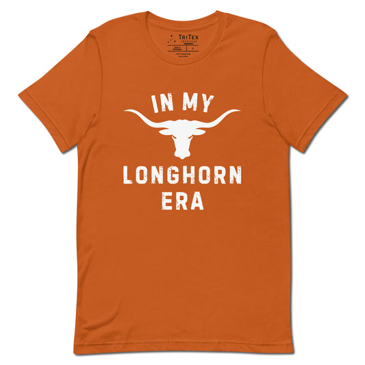 An autumn-colored t-shirt featuring a silhouette of a longhorn bull with the text "In my longhorn era".