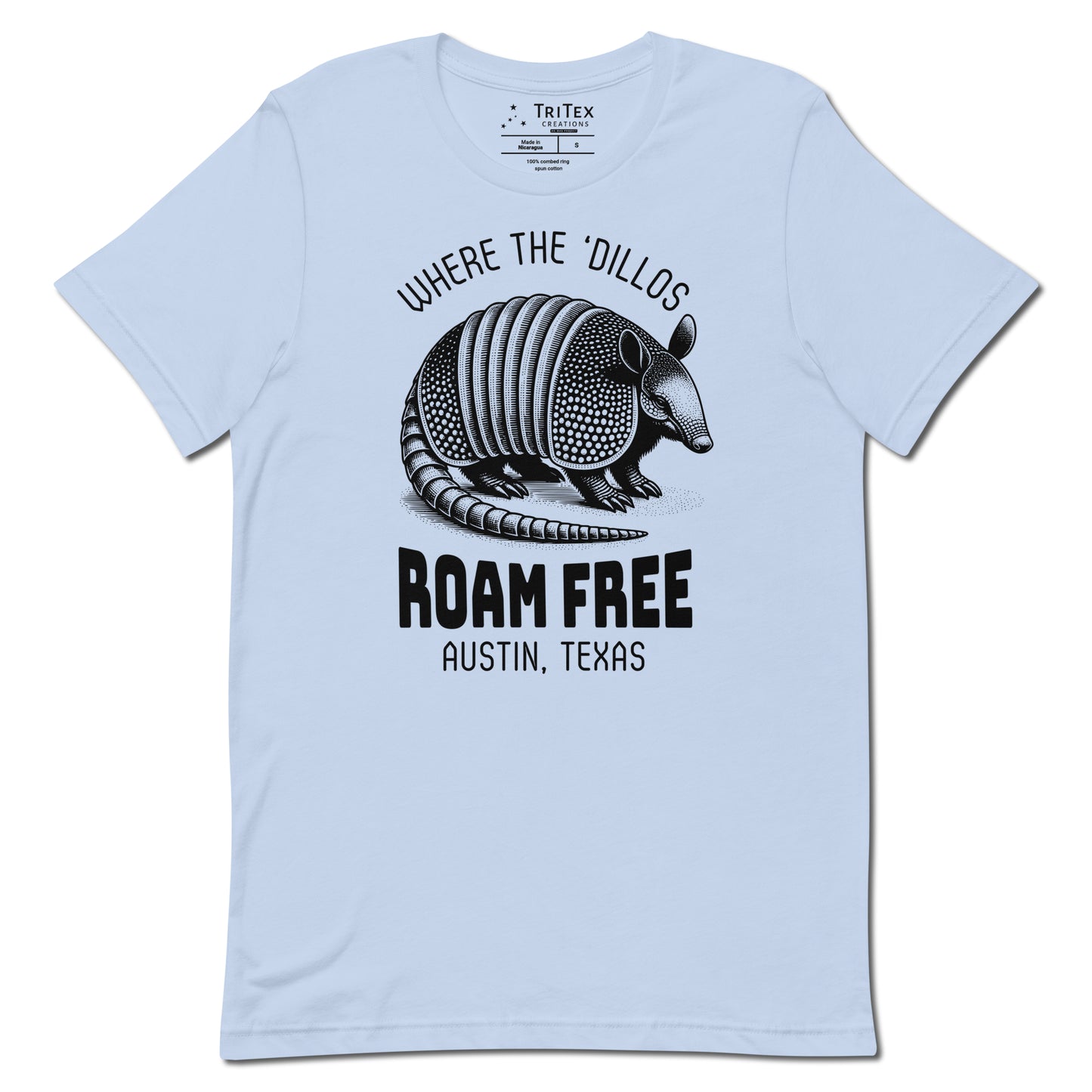 A baby blue t-shirt featuring a vintage illustration of an armadillo with the words "Where the 'dillos roam free. Austin, Texas".