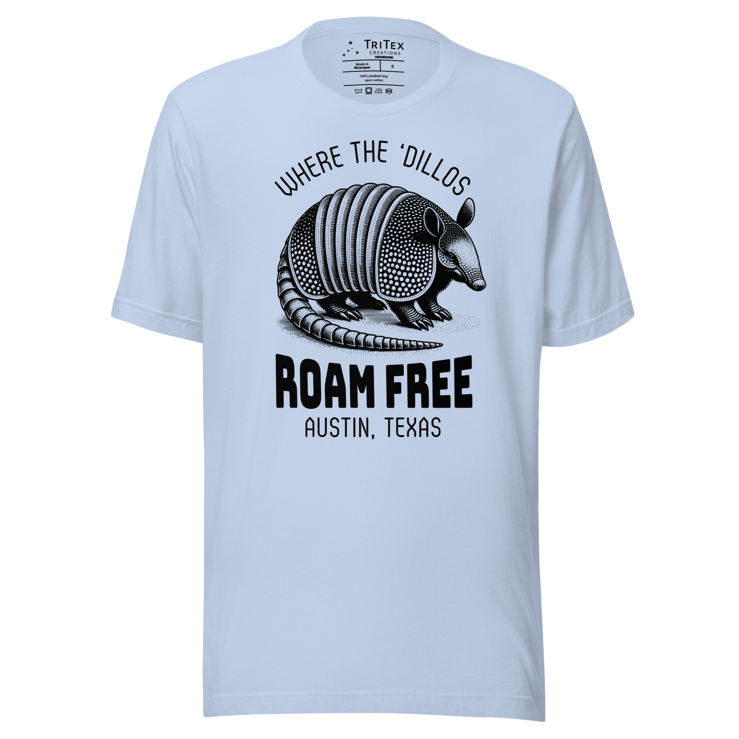 A baby blue t-shirt featuring a vintage illustration of an armadillo with the words "Where the 'dillos roam free. Austin, Texas".